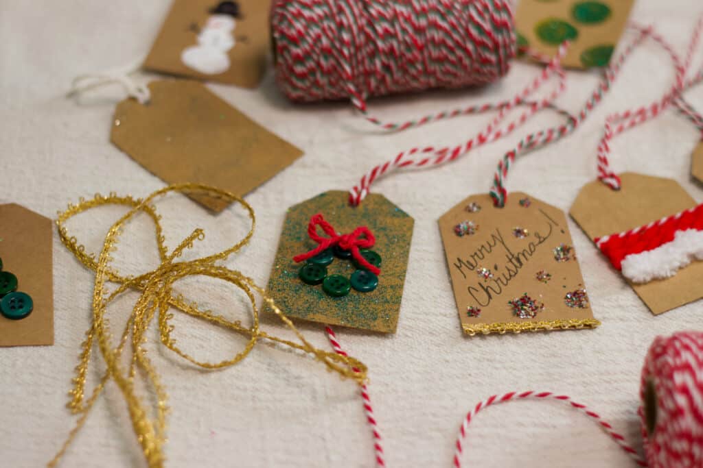 Premium Photo  Step by step. cutting out gift tags from brown paper with a paper  punch.